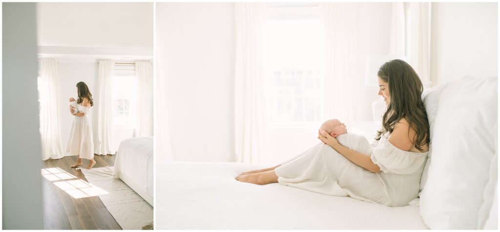 A mom wearing a white dress cuddles a new baby.