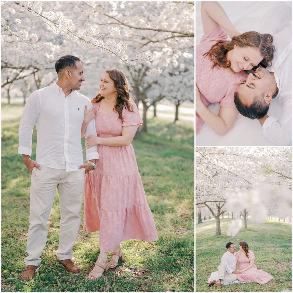 A couple is clearly in love as they sit under the cherry blossoms, smiling at each other during their photo session in Virginia Beach with Jessica Jeremiah Photography